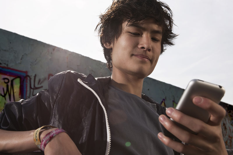 Teenager gambling on smartphone